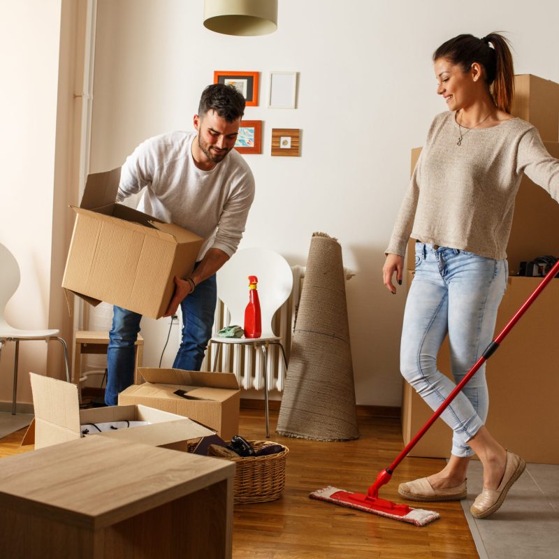 Young,Couple,Cleaning,And,Selecting,Things,At,They,New,Home.moving